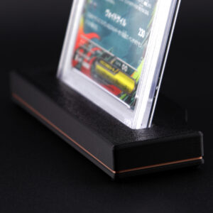 Graded card slab stand close up detail